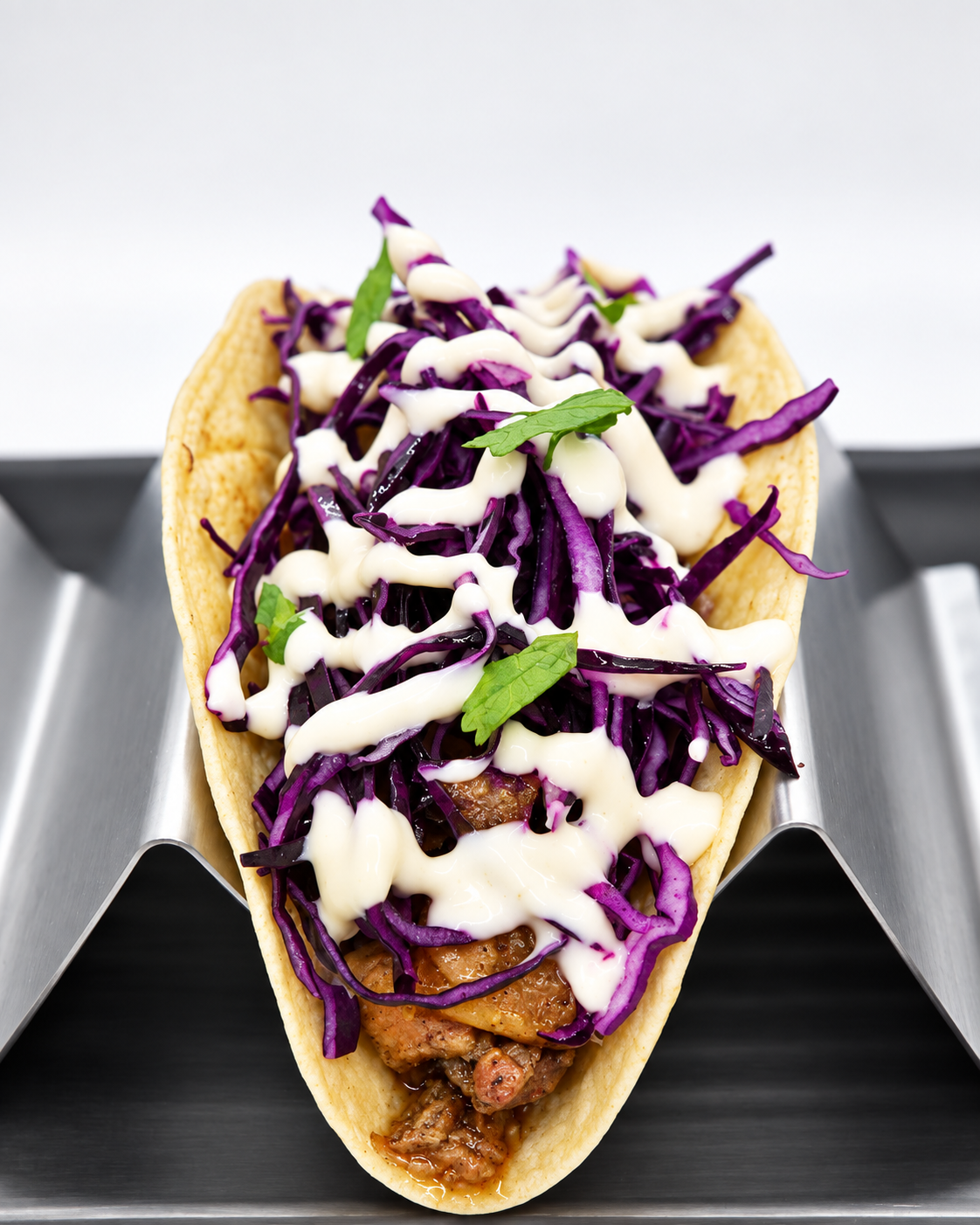 Jamaican jerk chicken taco with pineapple and red cabbage at The Taco 105
